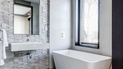 bathroom remodel with tile accent walls